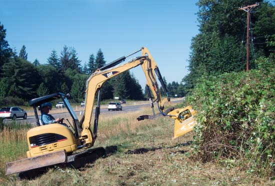 working on roadside brush, mounted on CAT 6 ton excavator