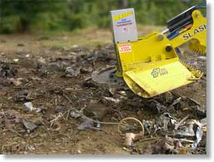 Close-up of debris field, showing shredded chunks of the car's blue body