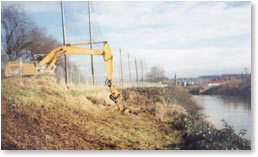 Brush cutter reaching over a fence